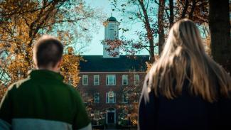 Two students looking at Cutler Hall