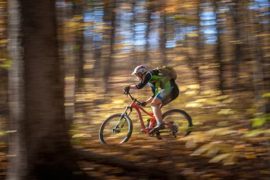 Mountain biker on the trails of Sells Park in Athens, Ohio