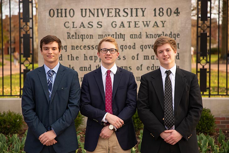 Executive Board members of the Derivatives Management Group pose in front of the Class Gateway