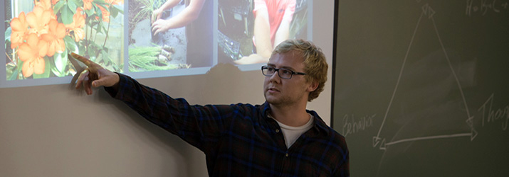 Evan Apt ’15 displays pictures from his internship at the Fairchild Tropical Botanical Garden in Florida.