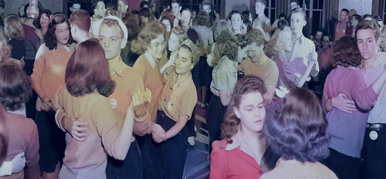 Colorized photo of mid-20th century youth dancing