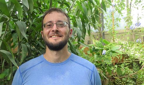 Andy Howes, portrait in greenhouse