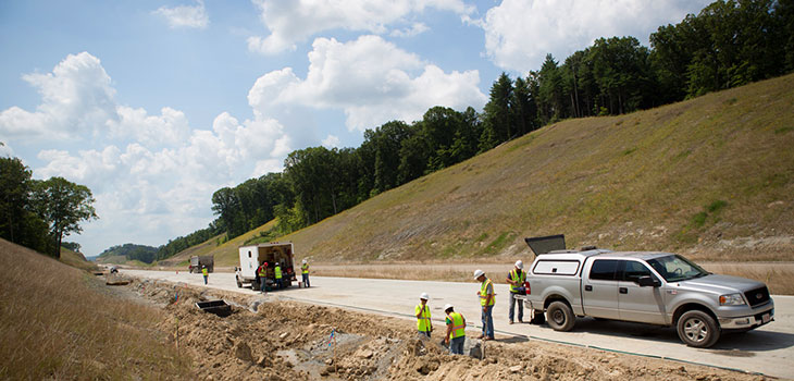 Construction workers on a road