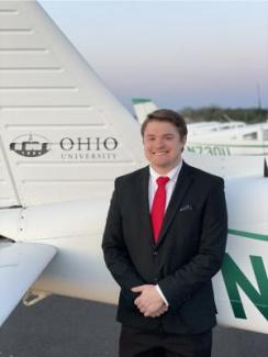 Michael Crist next to an airplane