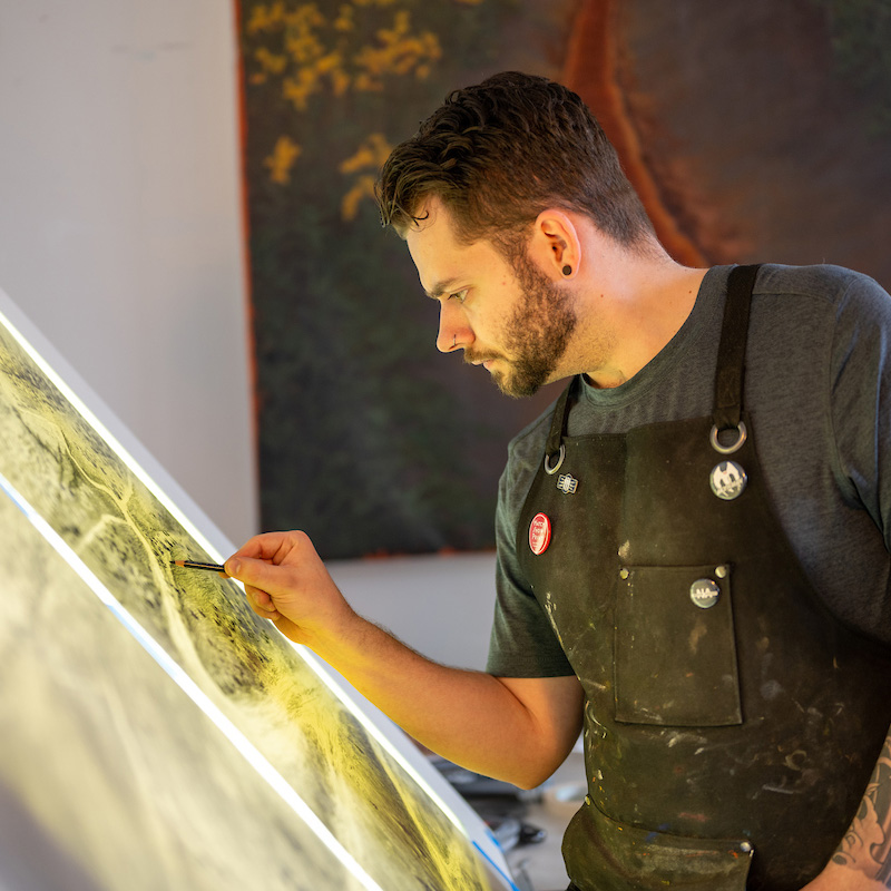 Student working over an easel