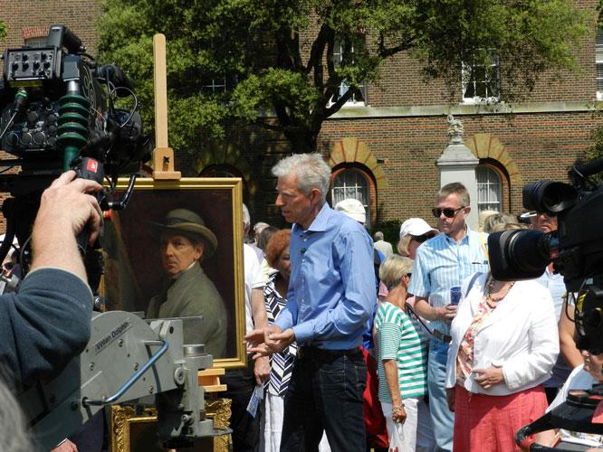 people on a street at an art auction