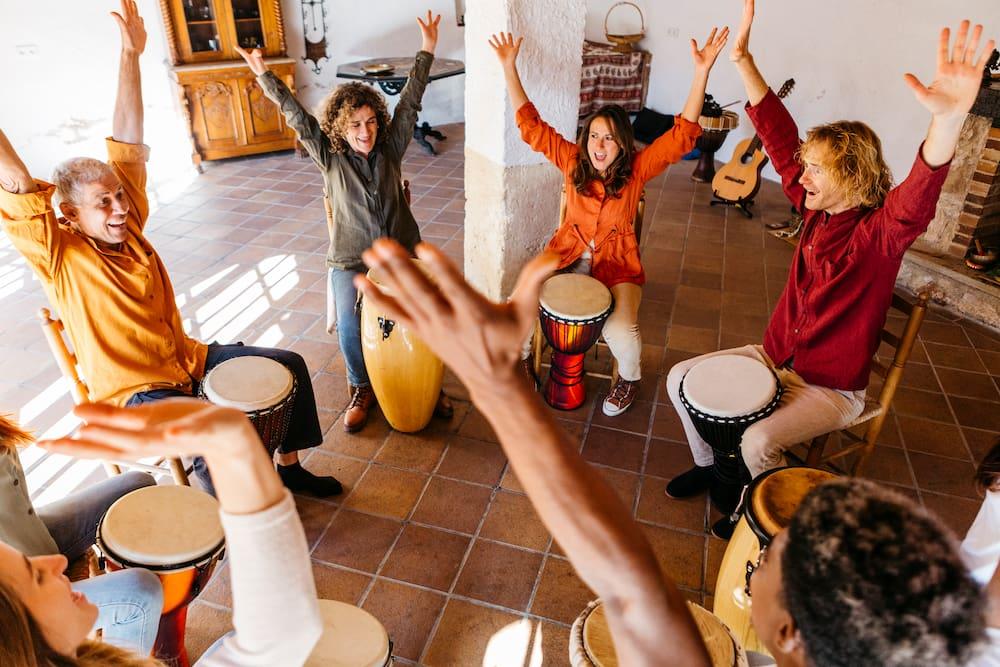 group of people in a drum circle