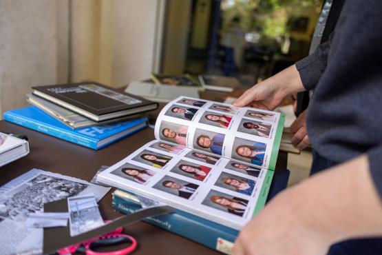 Alumni looking through yearbooks