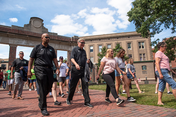 President Nellis walks through the gate with students during the 2019 Involvement Fair. Photo by Hannah Ruhoff