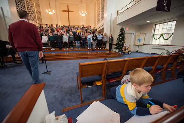 Kylie Duncan son Kameron drawing at Women's Ensemble