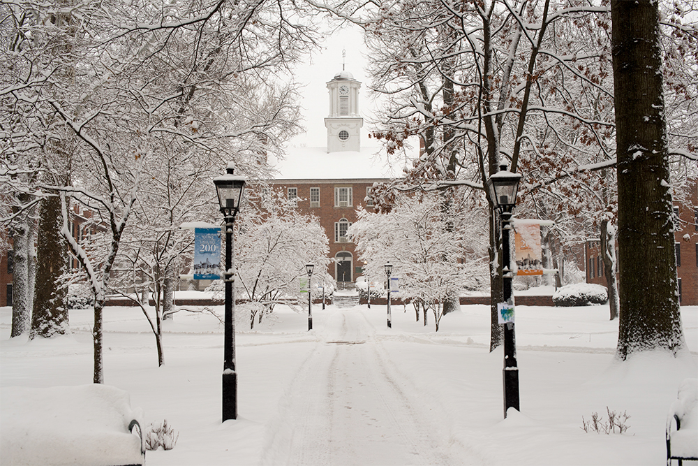 A view of Cutler Hall and College Green covered in fresh winter snow