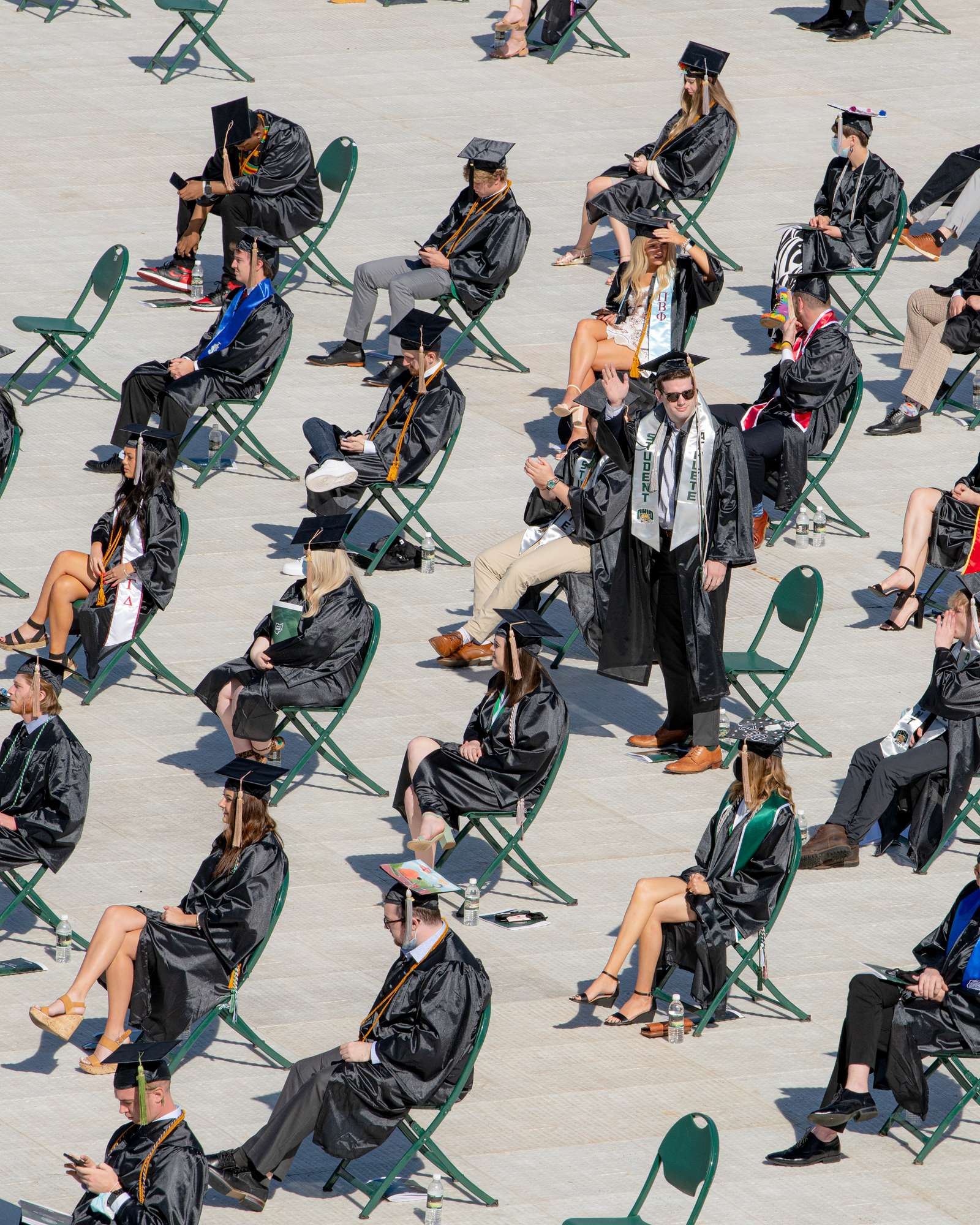 Students await their turn to graduate during commencement
