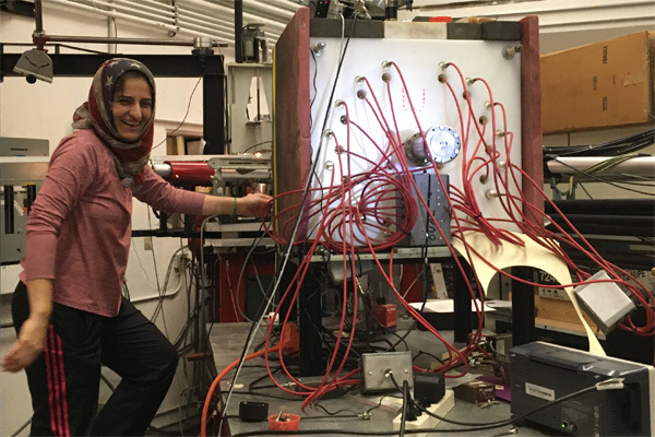 Ph.D. student Gula Hamad tests the new HeBGB neutron detector at the Edwards Accelerator Laboratory at Ohio University.