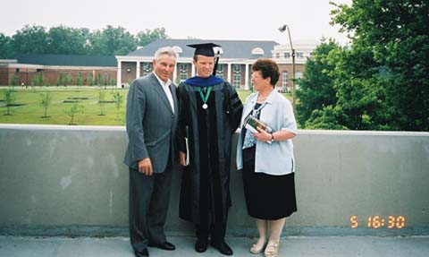 Weichselbaum, in cap and gown, with his parents