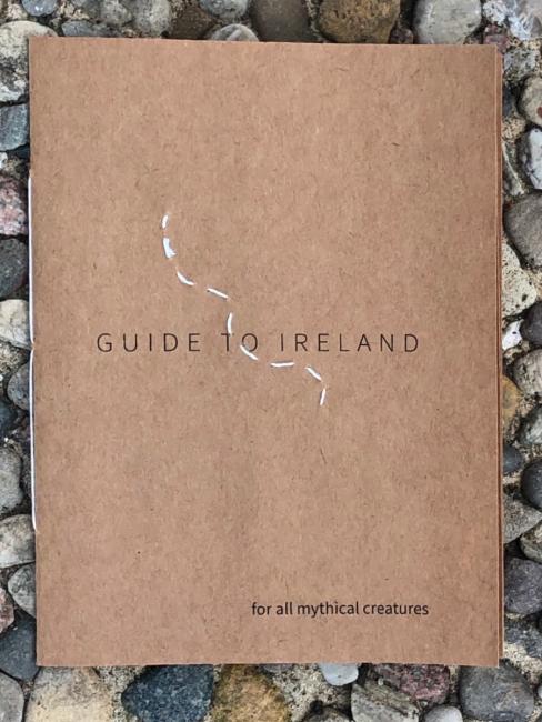 Handmade book with words stating "Guide to Ireland. for all mythical creatures"