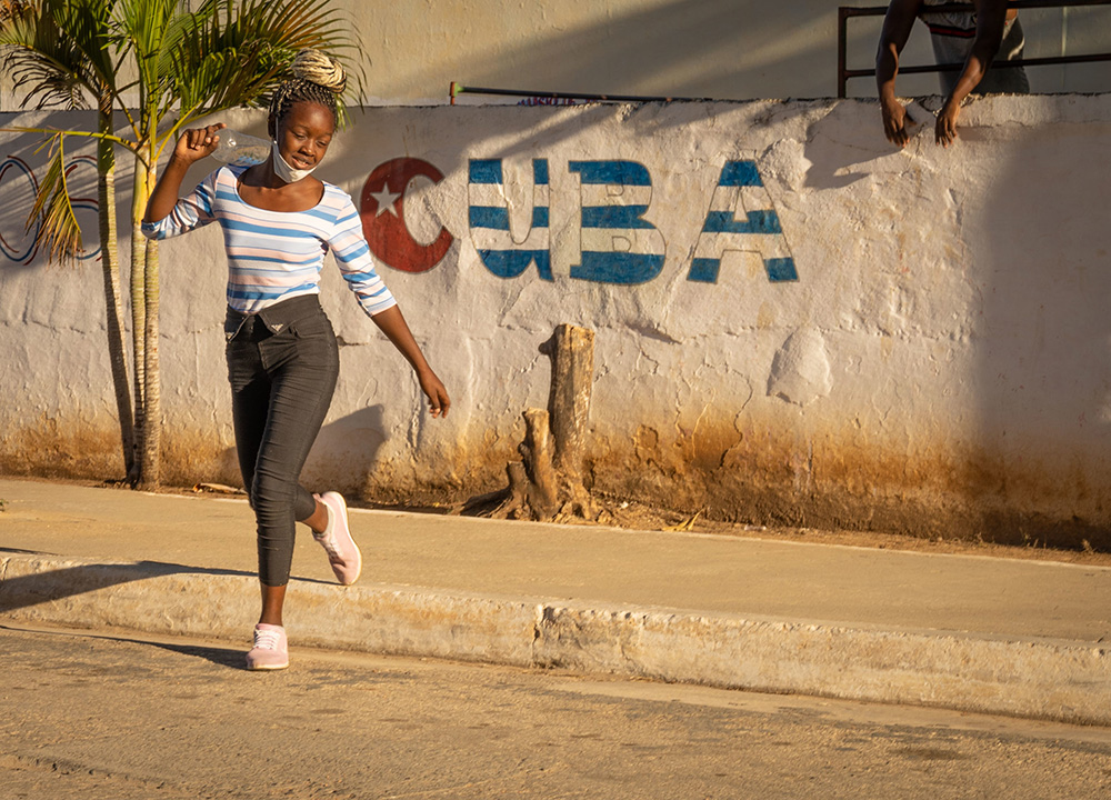 Girl gesturing on street in Trinidad, Cuba