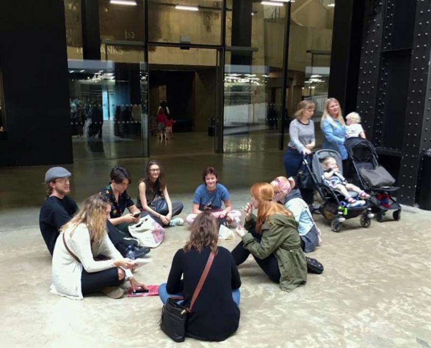 Students sitting in a circle taking a break