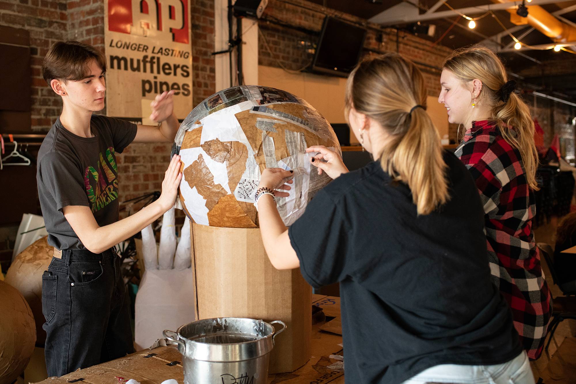 An Ohio University learning community works together at the Central Venue to create pieces to be used in the Passion Works Honey For The Heart Parade in Athens, Ohio.