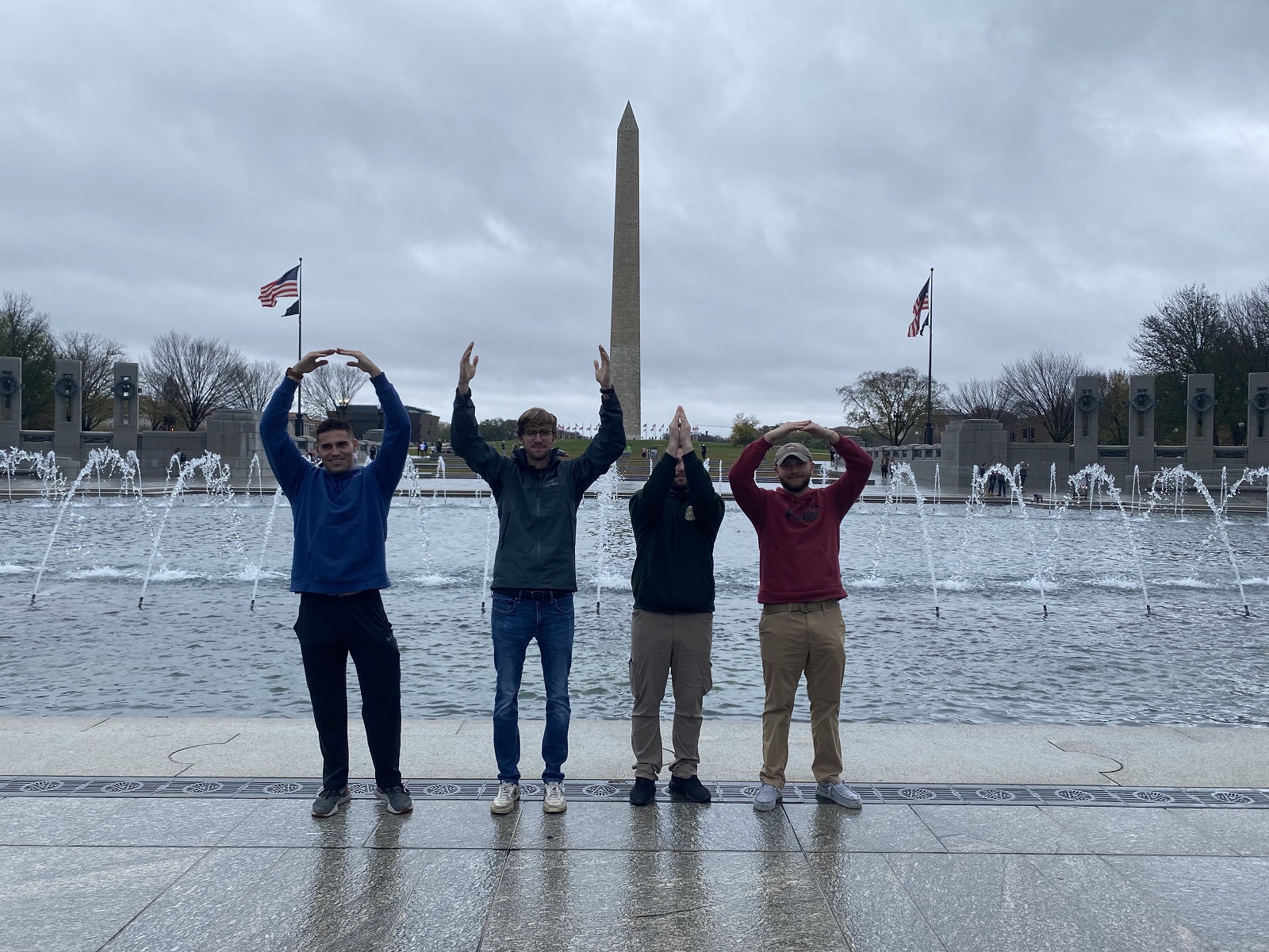 Colby Berry, Ethan Barnes, Jon Kostival, and Blade Eblin are shown at the WWII Memorial