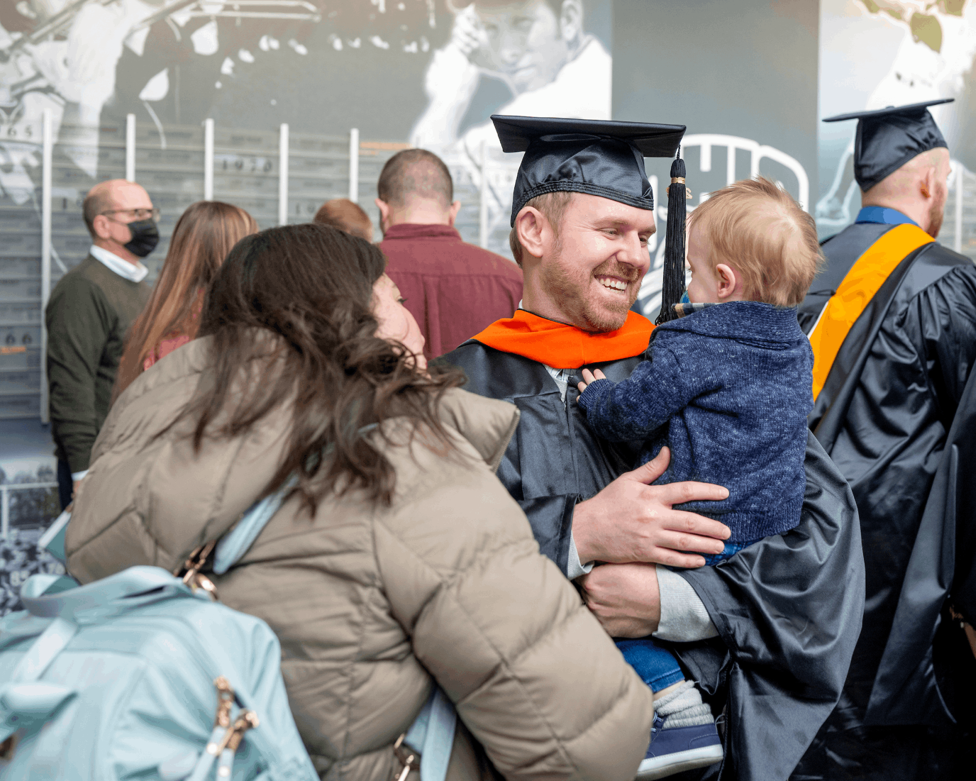 Graduate react following Fall Commencement.