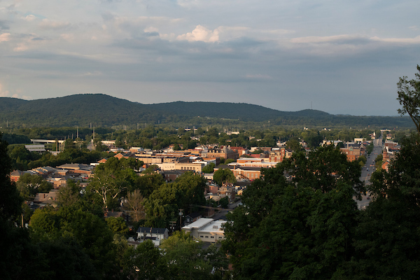 Aerial view of the skyline at Ohio University's Chillicothe campus, showing brick buildings surrounded by rolling hills of trees