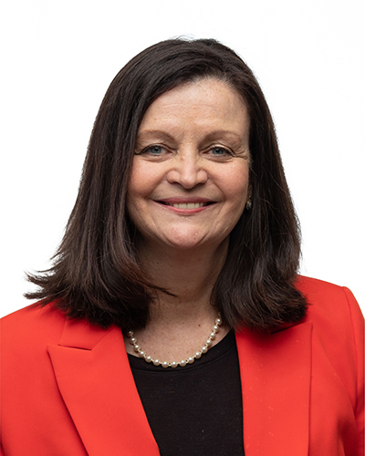 Photo of Tami Fitzgerald wearing a red blazer