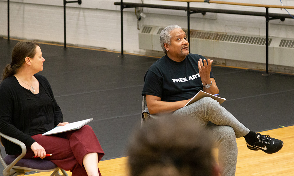 Dance faculty Travis Gatling talks to students