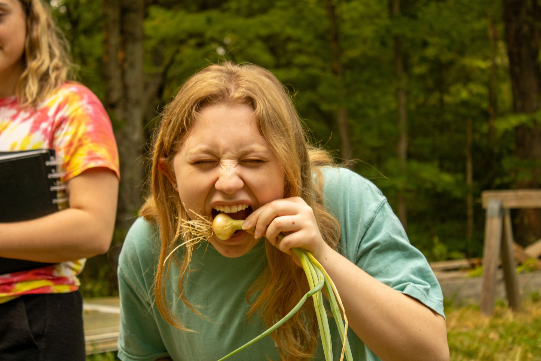 Veronica Jennings eating an onion