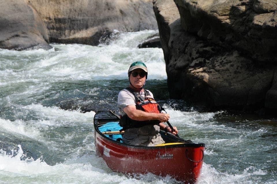 Ron Dingle is shown canoeing