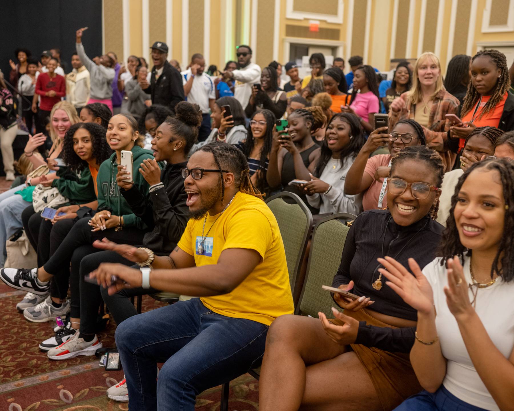Students react to a performance at the Multicultural Student Expo in the Baker Ballroom.