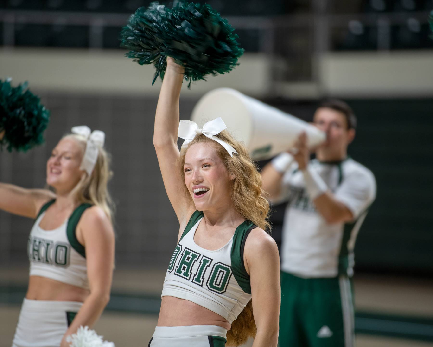 A cheerleader performs at the First Year Student Convocation.