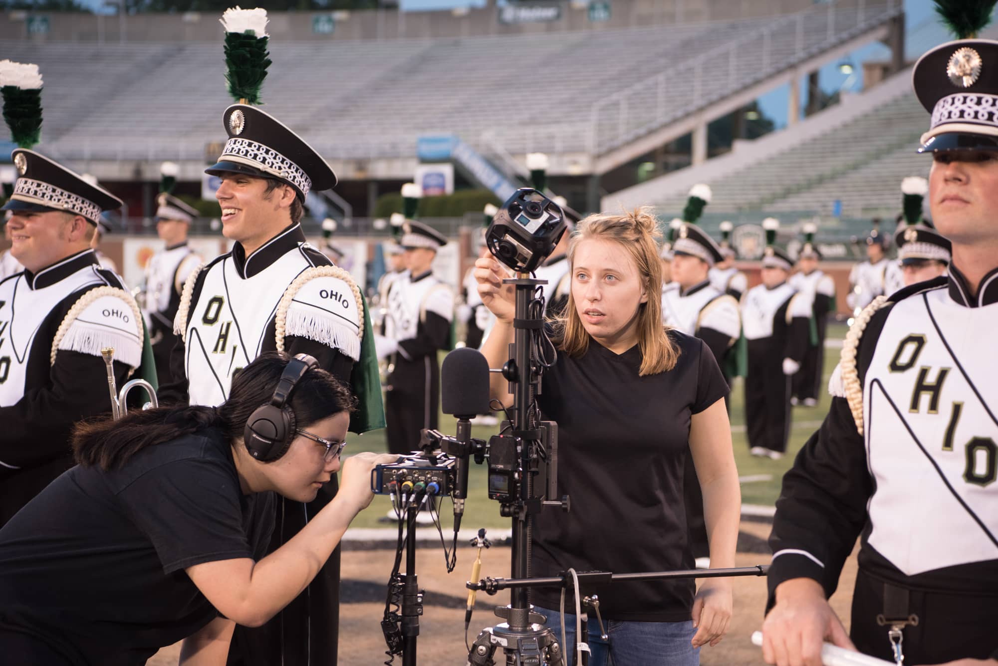 Media Arts undergraduate students record the Marching 110 using 360-degree video cameras.