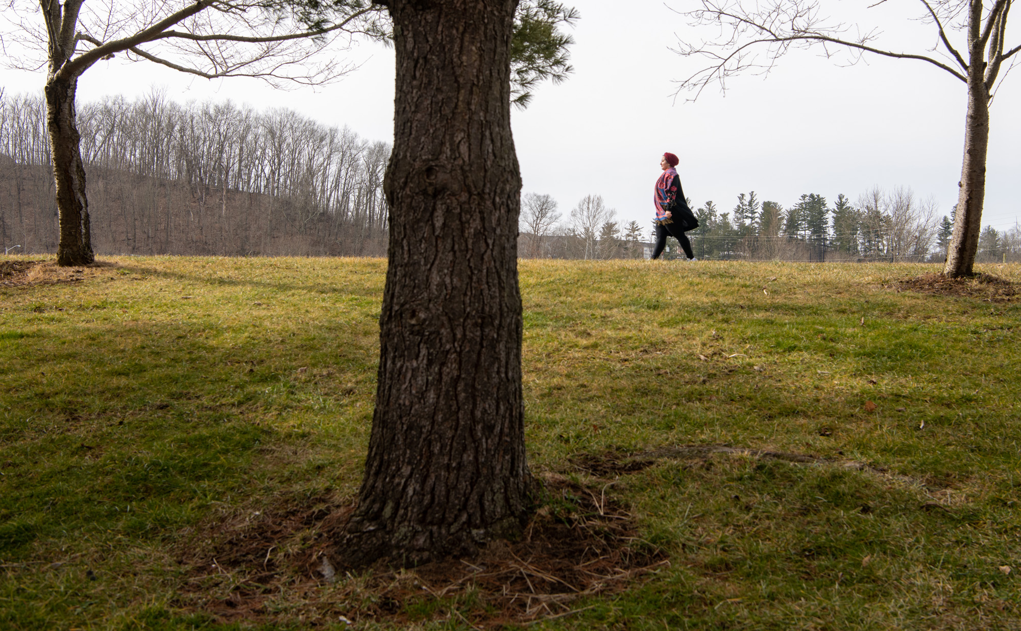 Habiba Abdelaal walking the bike path by trees