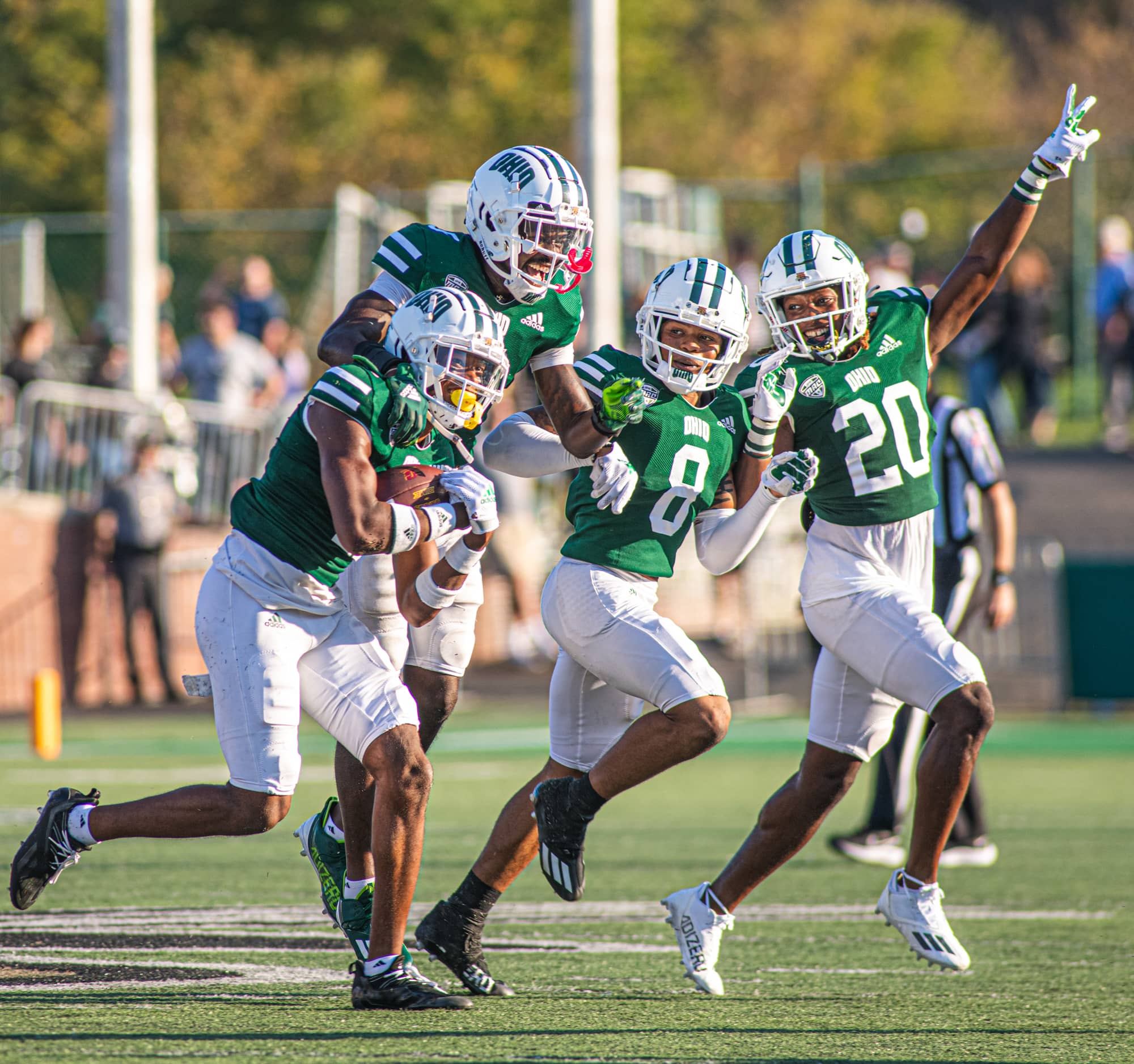 Tariq Drake, Jamison Collier, Justin Birchette and Alvin Floyd celebrate a play at the Homecoming Football game.