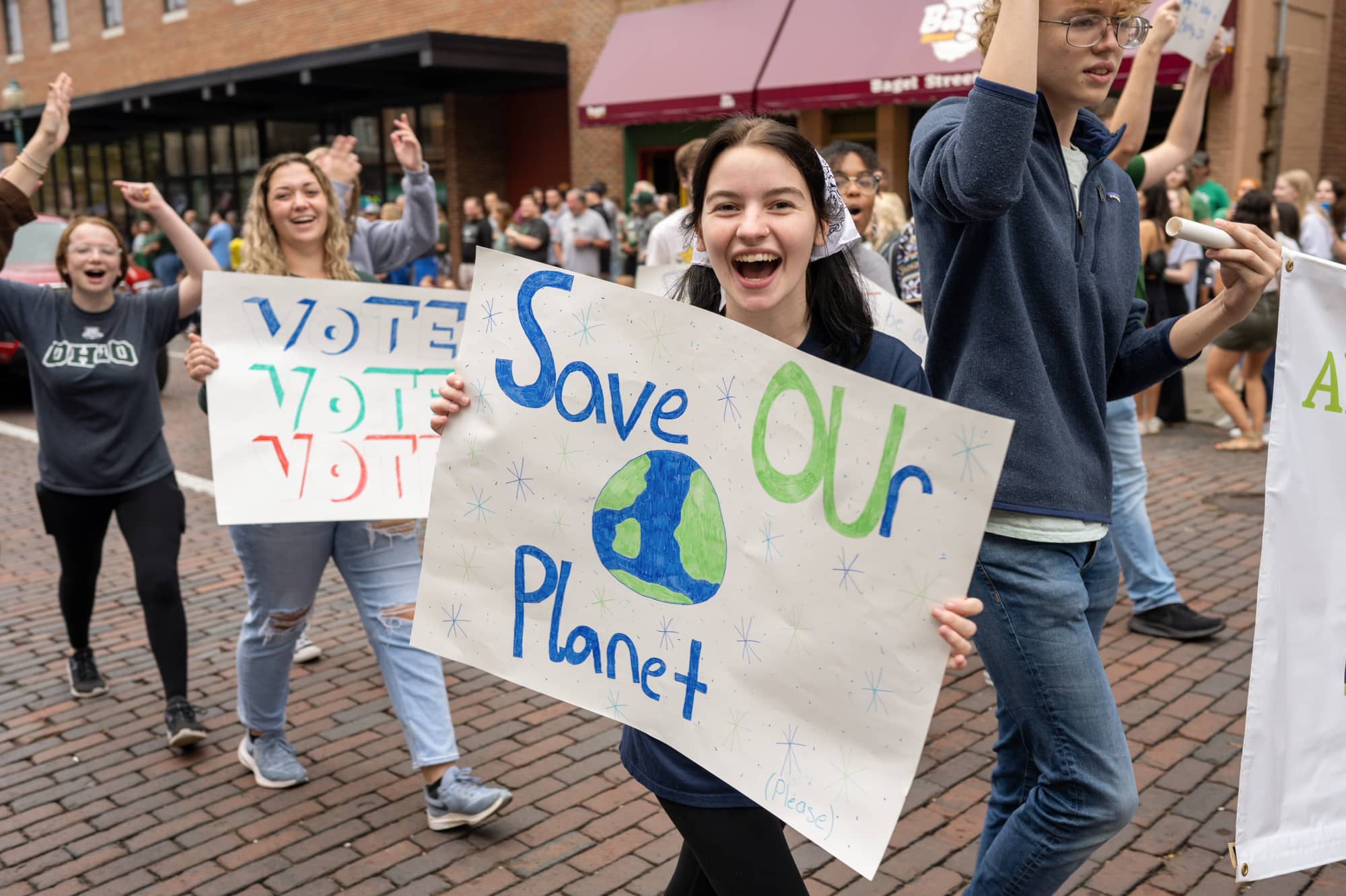 A student participates in the Homecoming Parade.