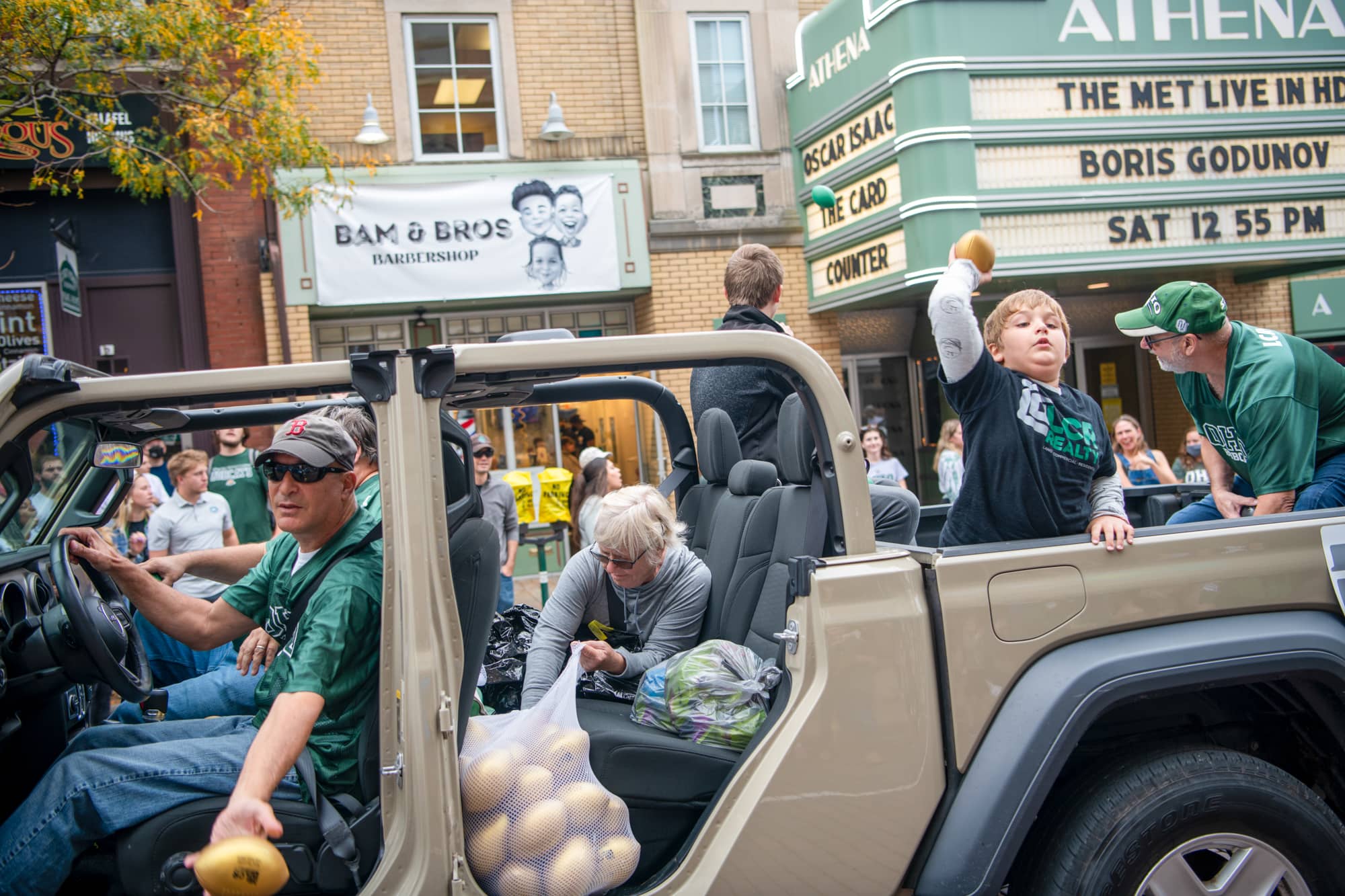 LCR Realty gives away tiny footballs at the Homecoming Parade. 