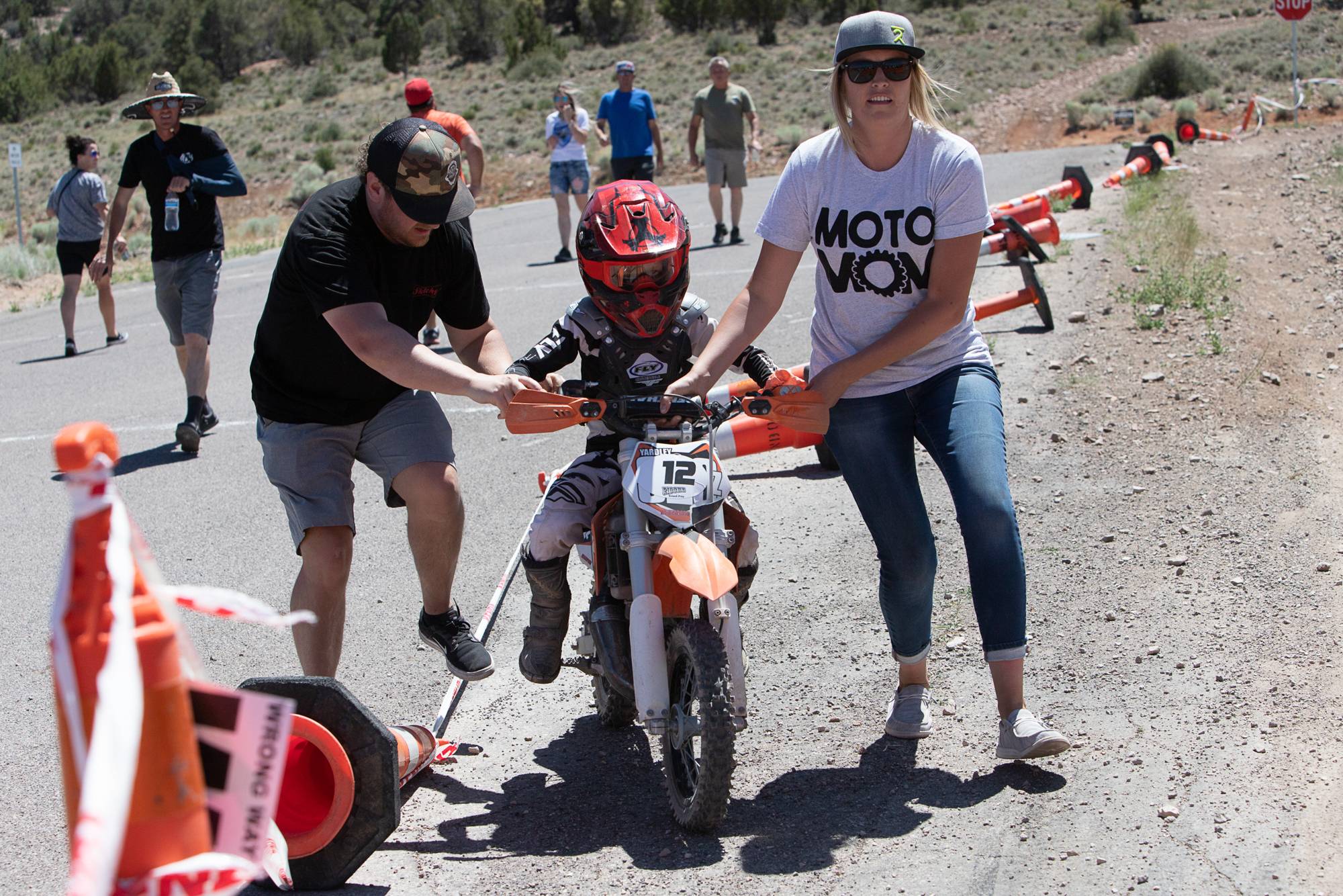 Grant Yardley is helped through the timing gate so his teammate can start their lap during the P-Wee team race at the Pioche Grand Prix in Pioche, Nevada, on Sunday, June 12, 2022.