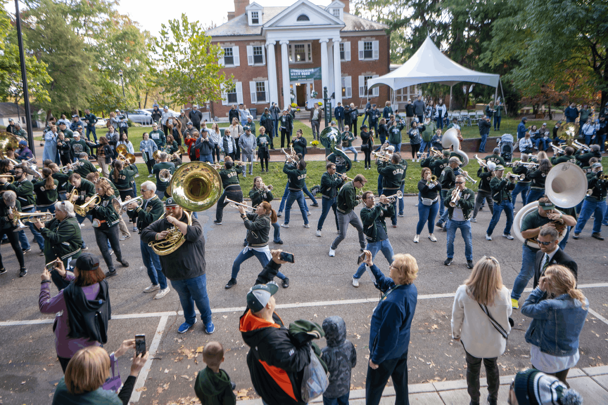 The “never too old to funk” Alumni Band stops for one last performance – in front of OHIO’s Konneker Alumni Center – during the Homecoming Parade before heading off for the Bobcat Bash and football game.