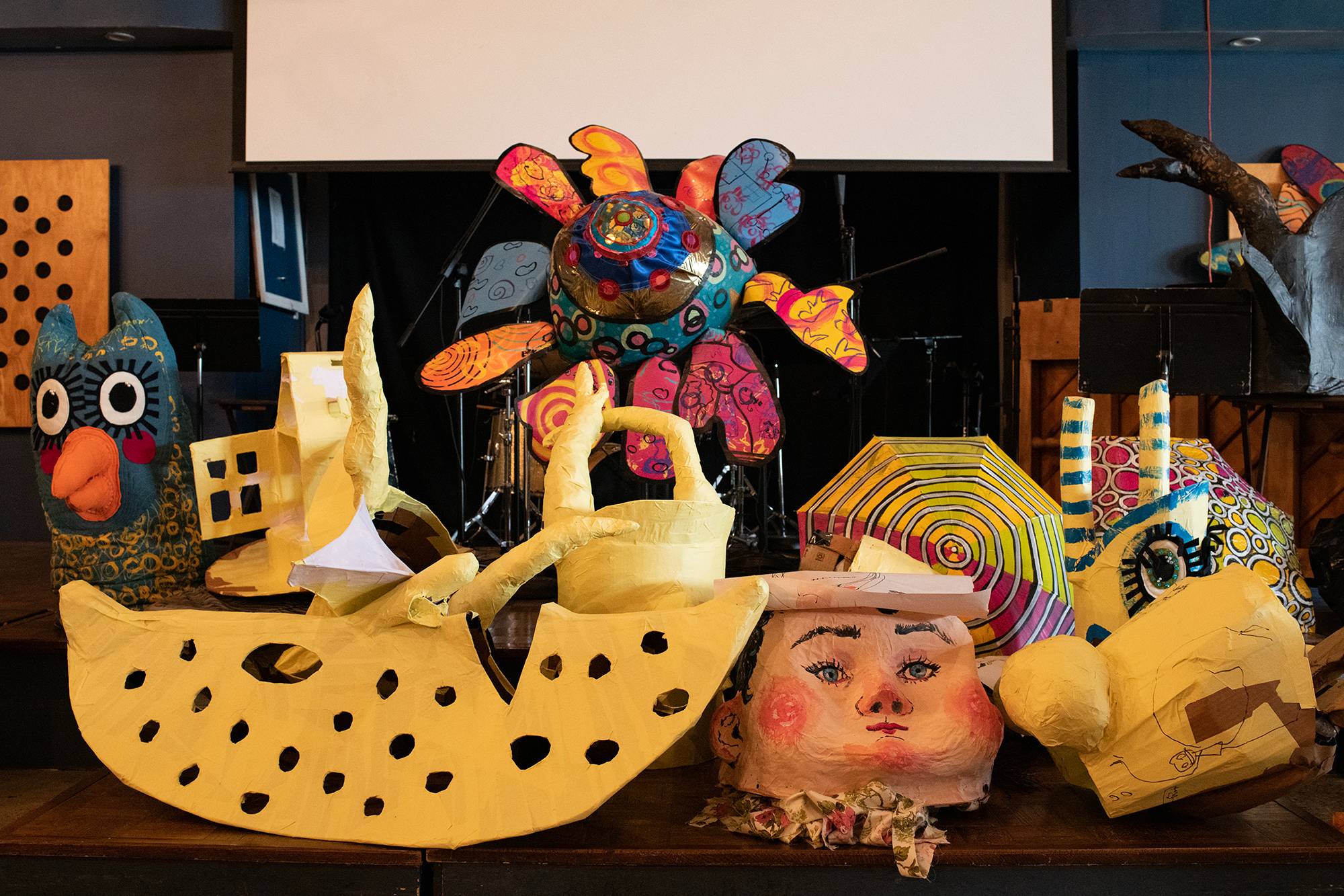 Costume pieces sit on a stage at the Central Venue in Athens, Ohio before being used in the Honey for the Heart parade.
