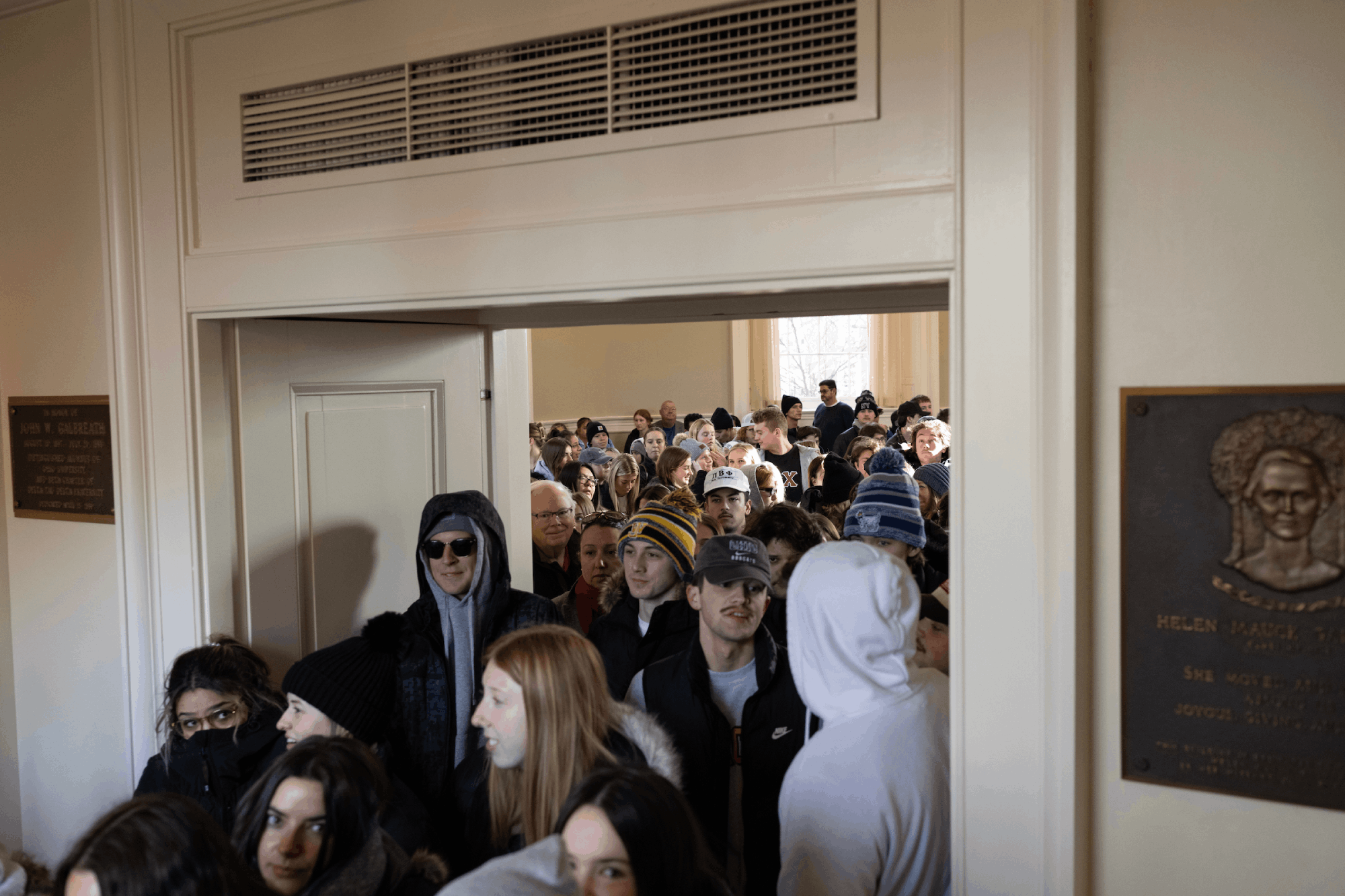 Community members, students, faculty and staff exit Galbreath Chapel to participate in the Silent March across College Green.