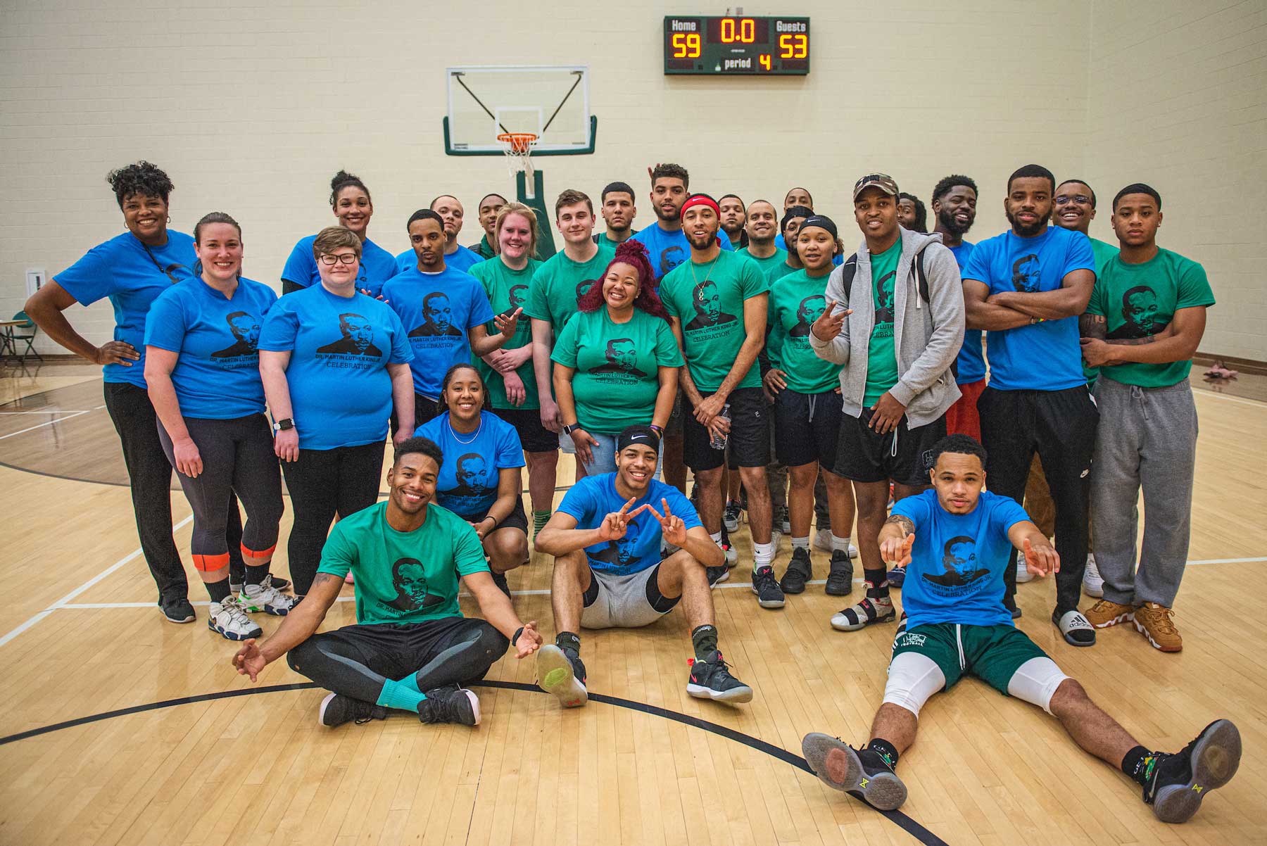A group photo of participants in the MLK Jr. Day charity basketball game.