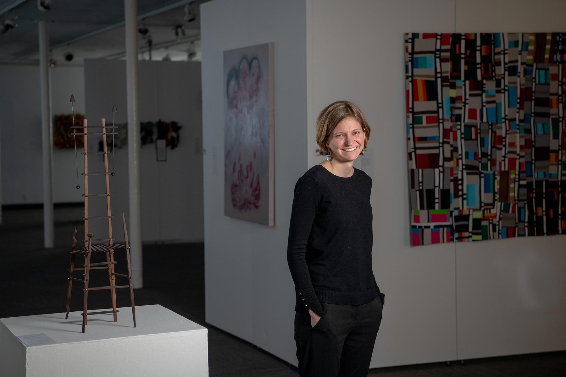 Leah Magyary standing in an art gallery