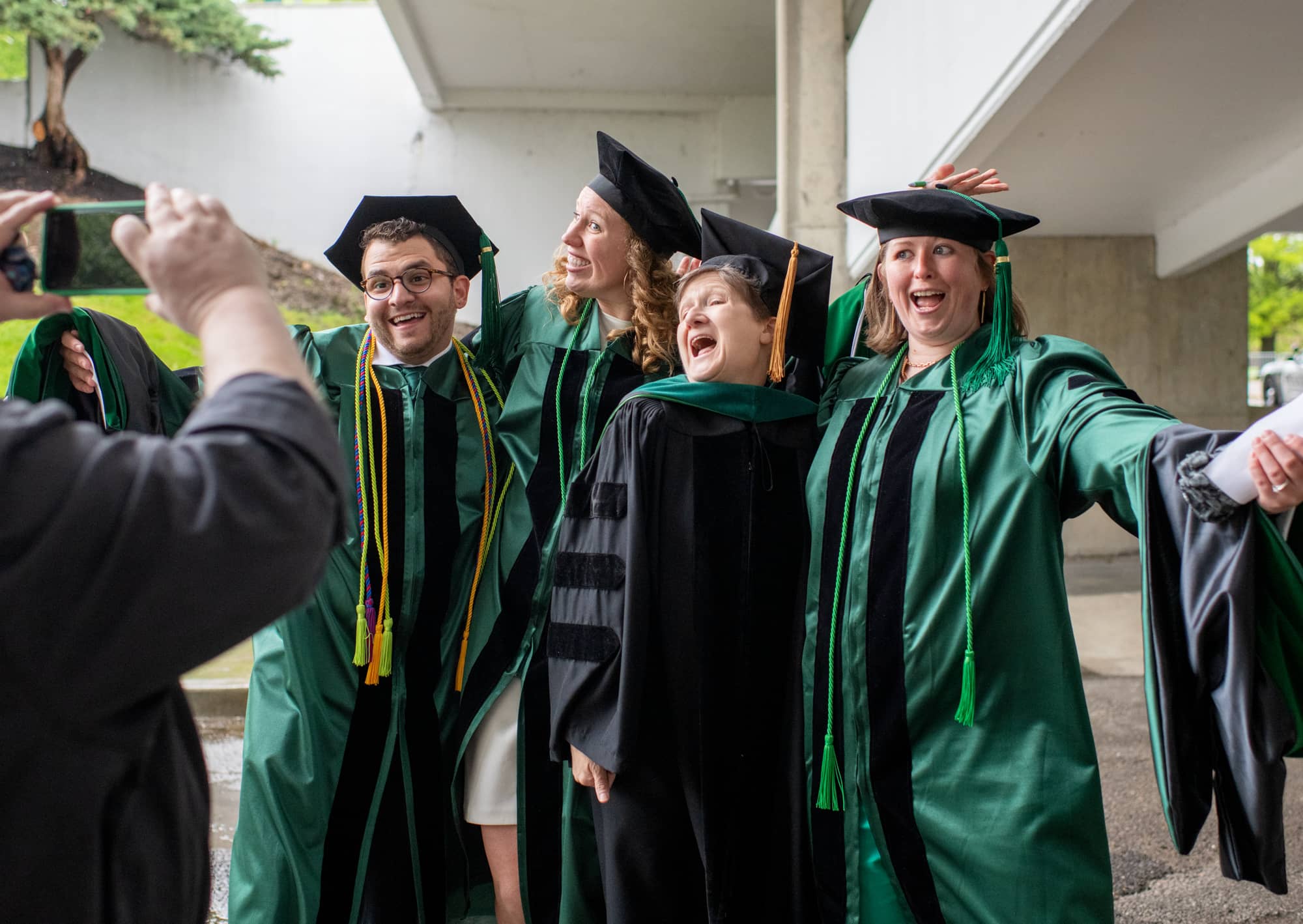 Heritage College graduates pose for photo at the Convocation Center prior to commencement.