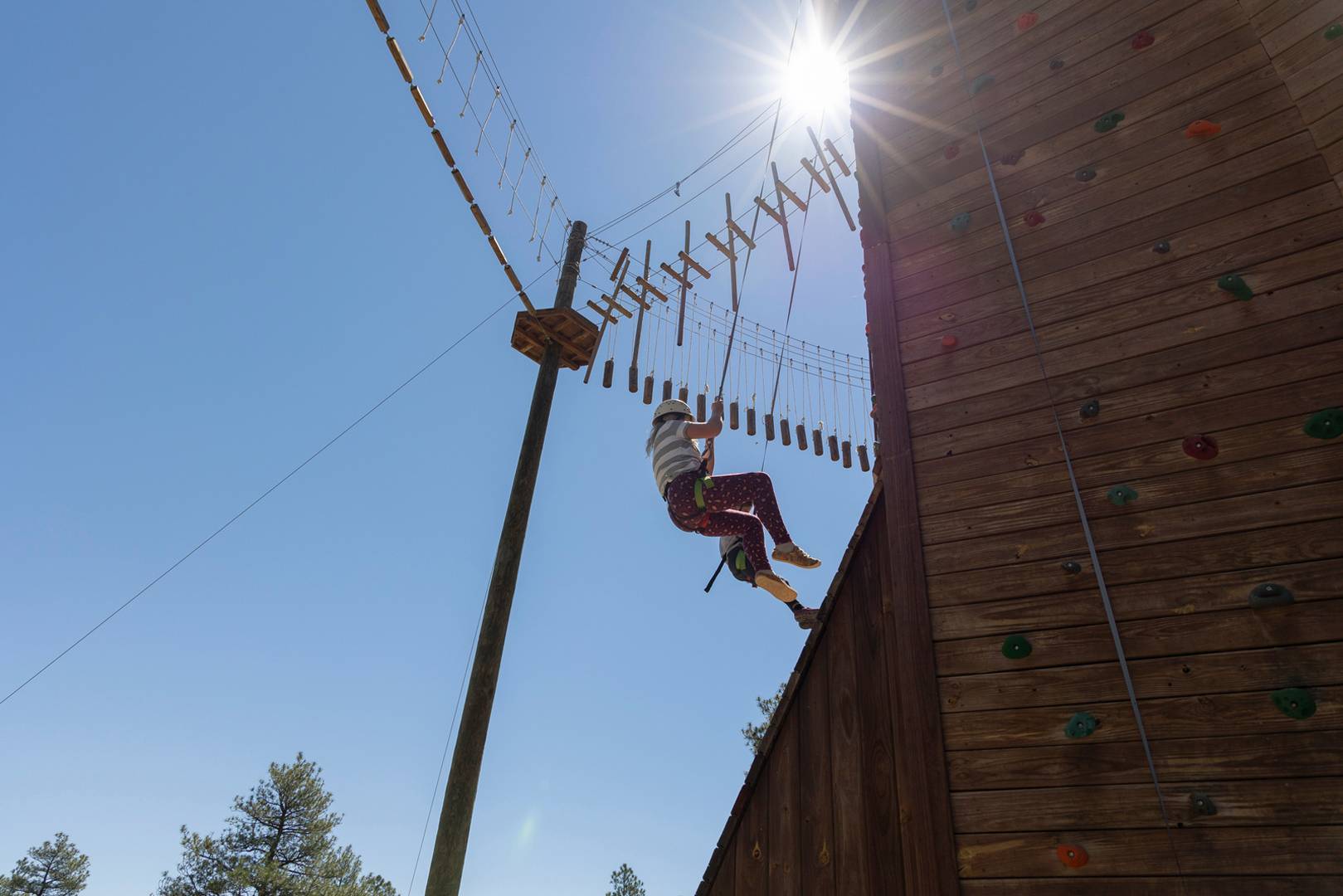 Philmont Training Center participants challenge themselves on a COPE course near the Tooth of Time in Cimarron, N.M., on June 29, 2022.