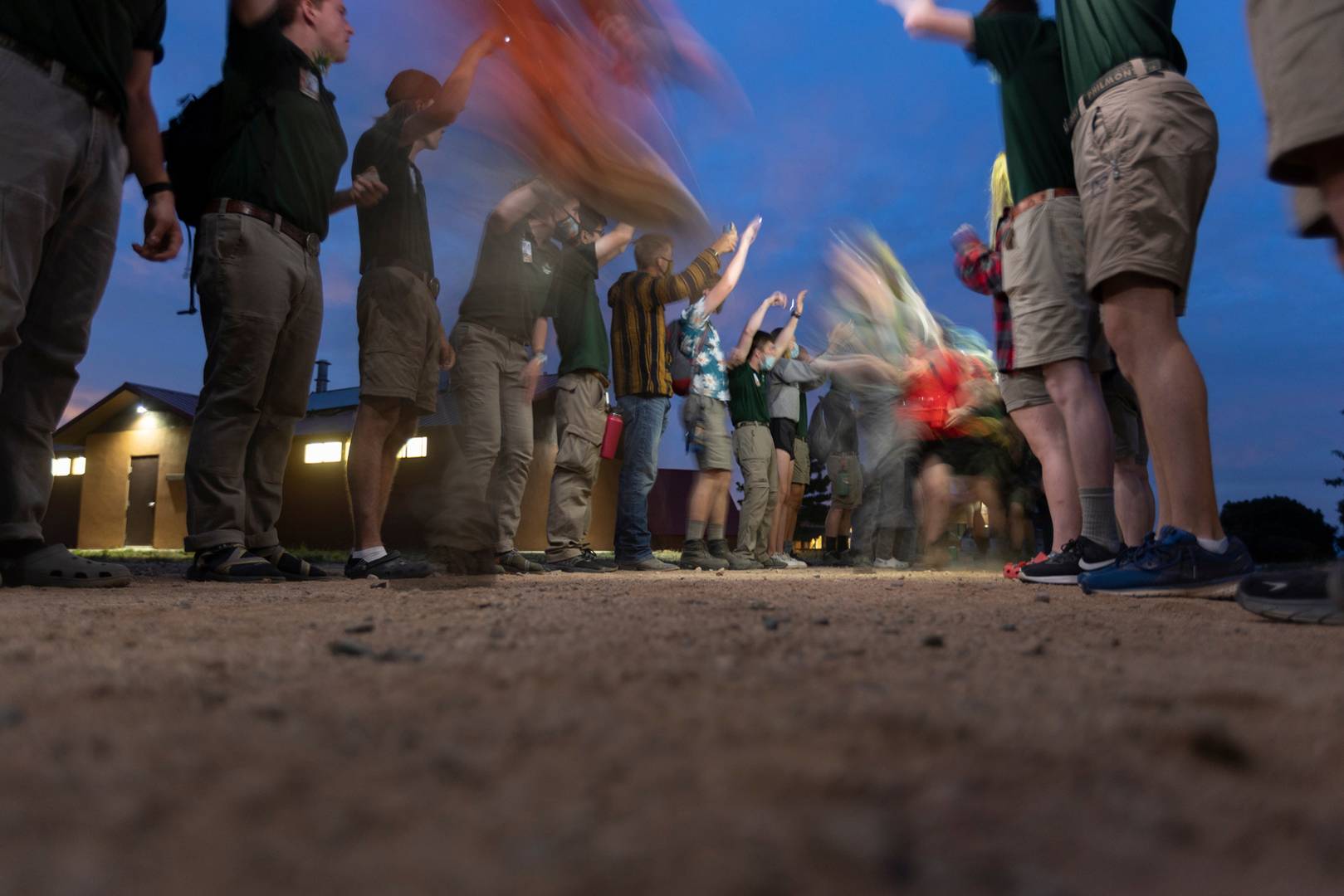 Rayado Crews run through a staff tunnel to start their trek on June 20, 2022, on Philmont Scout Ranch base camp in Cimarron, N.M.