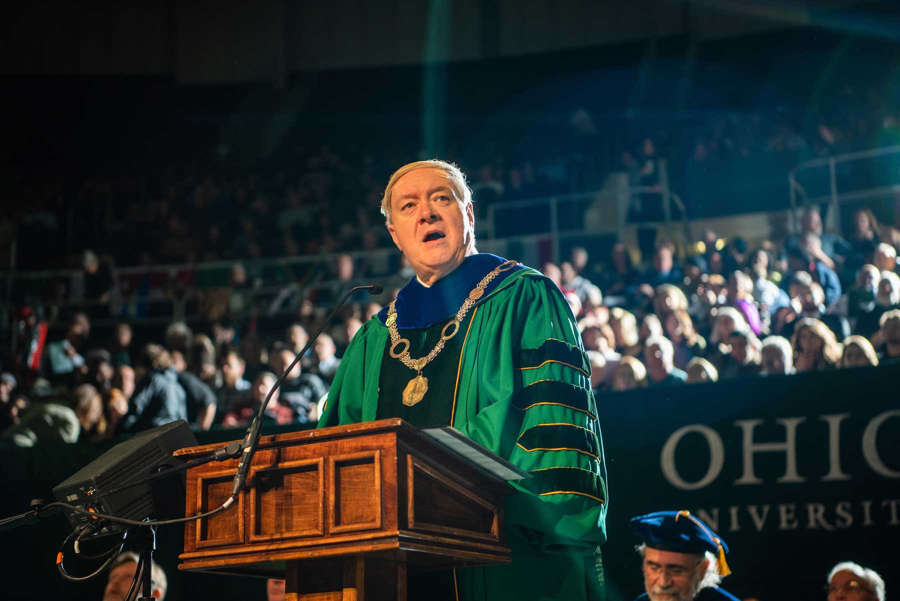 Portrait of President Nellis in front of the crowd at 2019 Fall Commencement