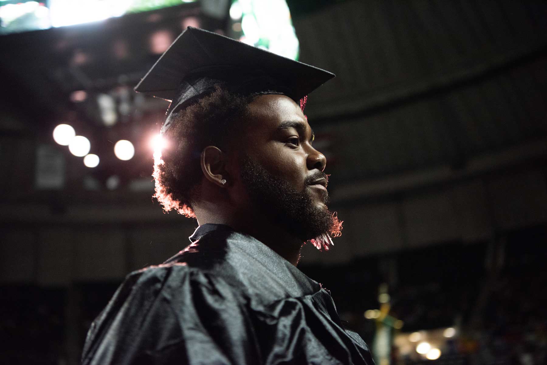 Side portrait of Sam McKnight, graduating senior