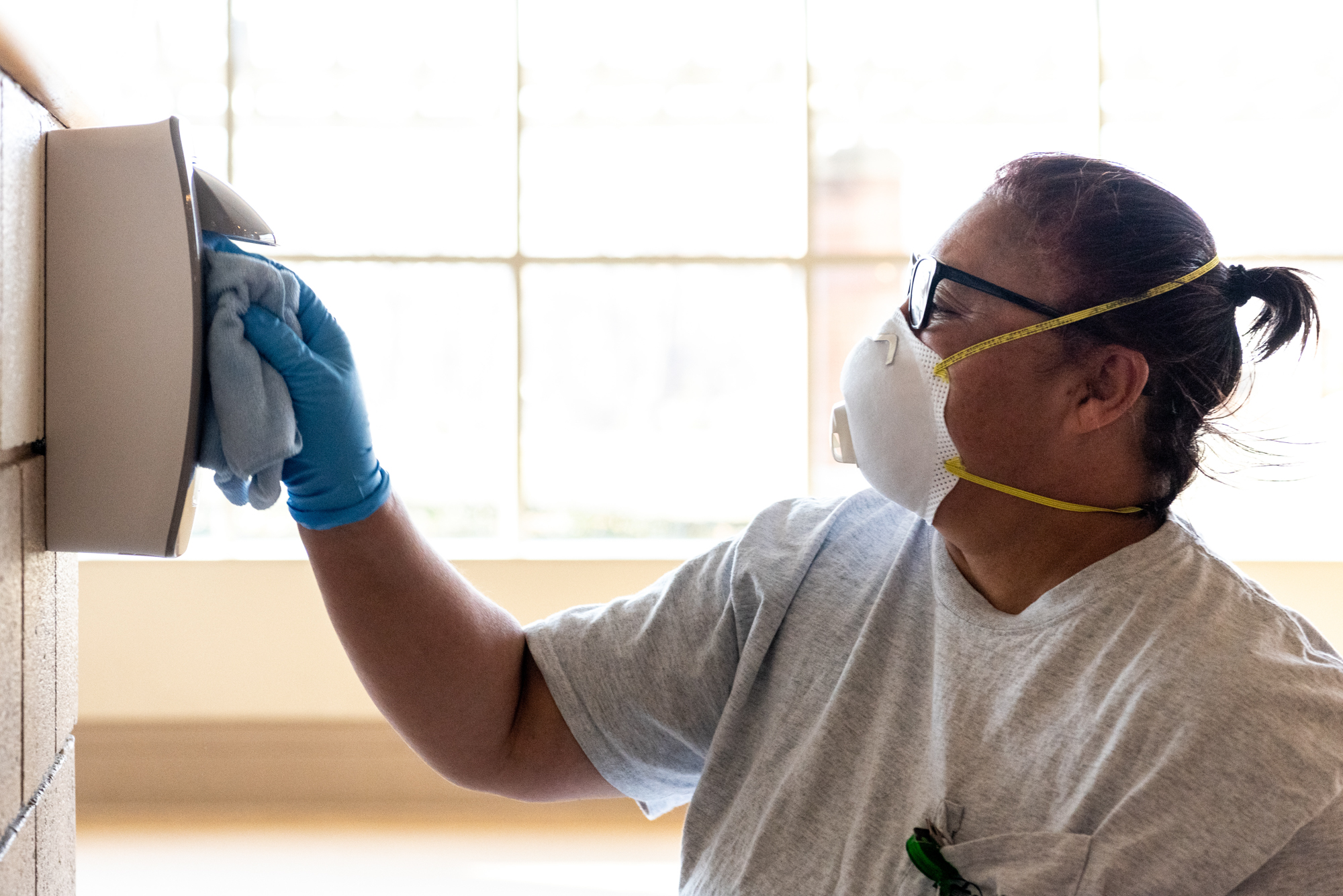 Ohio University custodial staff doing a careful cleaning of surfaces