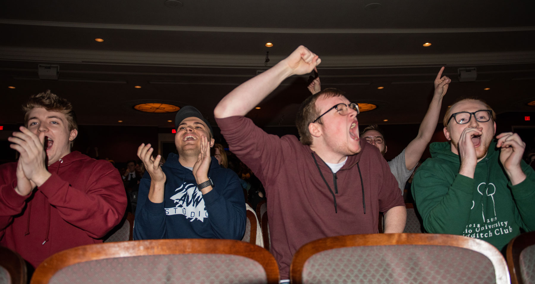 Students in a crowd cheering