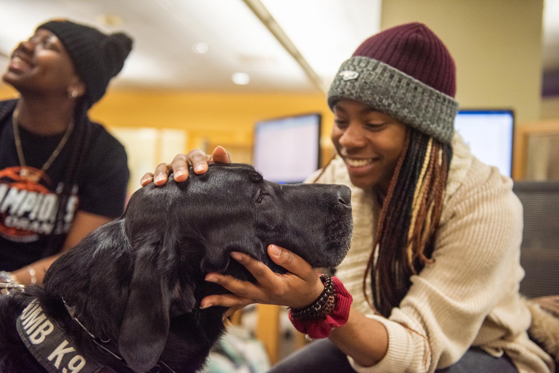 An OUPD bomb dog visits with students and gets petted